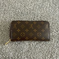 Excellent Condition. Comes With Garment Bag And Original Box. On The Go Matching Tote Mm Also Available Authenticity Papers Included In Photos. Luxury Brown Travel Wallets, Luxury Brown Trifold Wallet With Card Slots, Luxury Brown Trifold Rectangular Wallet, Luxury Brown Wallets, Luxury Brown Trifold Wallet, Garment Bag, Louis Vuitton Wallet, Original Box, Louis Vuitton Bag