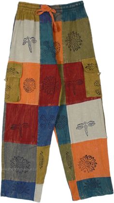 A beautiful pair of bright open-leg multi-color pants, a unique hippie statement piece to add to your wardrobe.  These hippie pants have a nice assorted set of stamps (Om, Ganesha, Eye of Budha, etc) that increase their hippie quotient, dominated with orange, blue, and shades of green. #tlb #SplitSkirtsPants #Patchwork #Stonewash #Yoga #Striped #bohemianfashion #CottonHippiePatchworkPants Colorful Bohemian Cotton Bottoms, Multicolor Hippie Harem Pants With Pockets, Hippie Multicolor Harem Pants With Pockets, Hippie Multicolor Pants With Pockets, Multicolor Festival Bottoms With Pockets, Multicolor Harem Pants With Pockets For Festival, Multicolor Hippie Harem Pants For Spring, Hippie Multicolor Harem Pants For Spring, Hippie Multicolor Harem Pants For Festivals