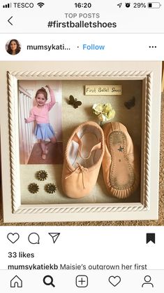 a pair of baby ballet shoes in a shadow box on the floor next to a tweet