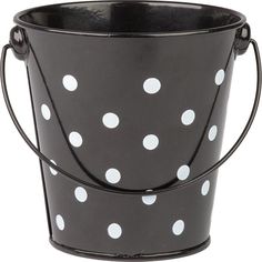 a black bucket with white polka dots on it