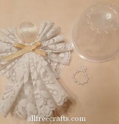 a doll's dress and accessories are on the table