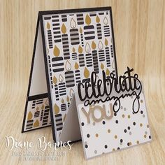 a card with the words celebrate you on it and a cake in front of it