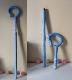 two pictures of blue objects with pink balls on them