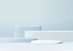 an image of a white table setting with minimal shapes on the side and light blue walls in the background