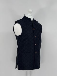 Introducing our exquisite Men's Jamawar Waistcoat, a luxurious addition to any gentleman's wardrobe. Handcrafted from the finest quality Jamawar fabric, this waistcoat is fully lined for added comfort. Featuring a timeless design, it comes with Gold buttons that add a touch of elegance to any outfit. The waistcoat also comes with pockets, providing ample storage space for your essentials. Perfect for formal occasions, this waistcoat is sure to make a statement and impress all those around you. Black Nehru Jacket For Winter Formal, Classic Black Nehru Jacket For Work, Traditional Black Formal Outerwear, Luxury Nehru Jacket With Stand Collar, Elegant Black Nehru Jacket For Winter, Winter Semi-formal Black Bandhgala, Black Nehru Jacket For Formal Occasions, Traditional Black Outerwear For Work, Luxury Semi-formal Nehru Jacket For Winter