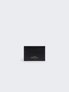 [vc_row][vc_column width=”1/3″][vc_column_text text_larger=”no”] Schiaparelli Schiaparelli Keyhole Cardholder This cardholder is made of smooth black palmelatto leather.   It features four exterior card slots and one cash pocket in the center.   It is adorned with a golden Keyhole bijoux and an embossed Schiaparelli logo and is fully lined in Shocking Pink leather. Schiaparelli Keyhole Cardholder has been a staple of the fashion world for decades. From the runway to the r Schiaparelli Logo, Schiaparelli Accessories, Shocking Pink, Stylish Celebrities, Fashion World, Pearl Drop Earrings, Pearl Drop, Pink Leather, Designer Collection