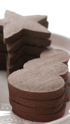 several cookies are arranged on a white plate