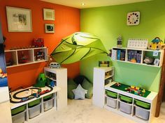 a child's room with green and orange walls