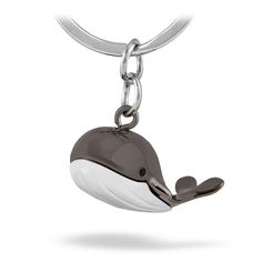 a keychain with a whale on it's side and a chain around the neck