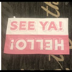 a pink and white sign that says see yah hefto