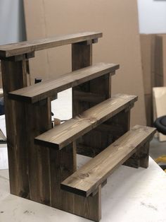 a wooden bench sitting on top of a white counter