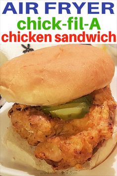 a chicken sandwich on a plate with the words air fryer chicken - fil - a chicken sandwich