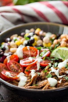 a bowl filled with taco salad on top of a table