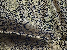 "Black Brocade Fabric by the yard wedding Dress Fabric Indian Banarasi fabric costume fabric jacquard fabric Silk Brocade Fabric in Black and Gold Weaving, Banaras Brocade Fabric. This is a exclusive and beautiful heavy blended benarse silk brocade floral design fabric in Black and Gold. The fabric illustrate golden woven floral vines on Black background. This Fabric is great for Curtains, sofa covers, cushion covers. Color: Black and Gold. Fabric Type: Blended Silk (Viscose and Silk) Super Fine Dresses Punjabi, Gowns Simple, Korean Wedding Dress, Banarasi Fabric, Dresses Corset, Silk Brocade Fabric, Wedding Dresses Indian, Wedding Dress Fabric, Open Backs