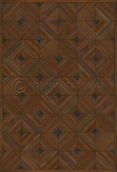 a wooden floor with an intricate design