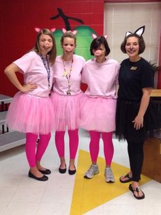 three girls dressed in pink posing for the camera with their hands on their hipss