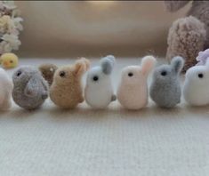 small stuffed animals are lined up in a row