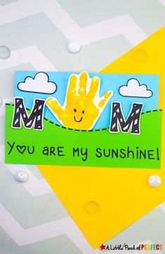 a handprinted card that says, you are my sunshine