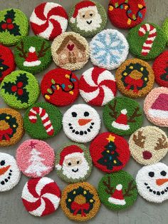 knitted christmas ornaments are arranged on the floor