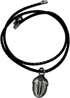 This is a neat and unique item - it's a necklace made from a metal Elrathia Kingi Trilobite reproduction.   The trilobite on the necklace is 1 inch in length.  The necklace cord is black braided faux leather.   Elrathia is a genus of ptychopariid trilobite species that lived during the Middle Cambrian of Utah, USA. This is the most common species of trilobites found in the USA.  This particular trilobite was cast from a trilobite that was dug from a quarry near Delta, Utah USA. We have a variety of necklaces and keychains available so be sure to check out our other listings! Utah Usa, Necklace Cord, Black Braids, Wedding Jewellery Necklace, Wedding Necklace, Keychains, Utah, 1 Inch, Wedding Jewelry