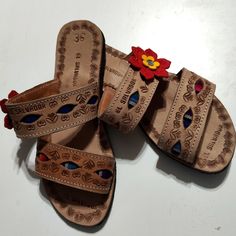 This Pair Of Handmade Sandals Have A Woven Blanket In The Straps With A Red And Yellow Leather Flower. They Look To Have Been Never Worn. Thanks For Looking And Have A Great Day. Ask Any Question Or Shoot Us An Offer. Red Leather Open Toe Huarache Sandals, Handmade Red Leather Sandals, Casual Handmade Brown Sandals, Casual Brown Handmade Sandals, Handmade Brown Open Toe Sandals, Red Open Toe Huarache Sandals For Beach, Brown Handmade Sandals With Round Toe, Handmade Brown Sandals With Round Toe, Handmade Leather Flat Sandals