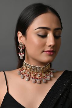 Indian Bridal Jewelry Set, Bridal Necklace Choker Earring Set, Meenakari Statement Necklace, Kundan Jewelry Set, Bollywood Evening Jewelry The majestically handcrafted Kundan necklace set is the best match to the Indian tradition and intricate work handcrafted by the artisans of India. The Kundan set is a masterpiece inspired by Sabyasachi jewelry to give you a royal look. The bold and bright design of the necklace is perfect for all the beautiful women * Necklace Length: Choker (comes with adjustable dori) * Earrings Length: 1.5 inches approx * Material: Brass and stone * Package: Necklace and earrings * Color: Choose from the drop-down menu STYLE TIP: This piece of elegant jewelry goes well with all your modern as well as traditional outfits. Best match for your wedding outfits ABOUT US: Kundan Traditional Wear With Motifs For Reception, Traditional Wear With Meenakari For Reception, Ceremonial Kundan Chandbali Necklace With Motifs, Ceremonial Chandbali Kundan Necklace With Motifs, Ceremonial Multicolor Meenakari Lehenga, Gold Traditional Wear With Motifs For Reception, Silver Meenakari Choker For Ceremonial, Silver Meenakari Choker For Ceremonial Occasions, Silver Meenakari Choker For Ceremonial Events