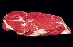 raw meat is shown on a black background