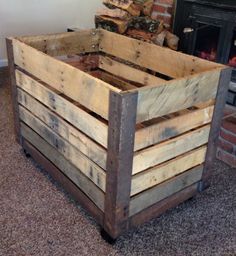 a wooden crate sitting in front of a fire place