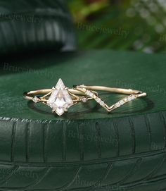 a diamond ring sitting on top of a green tire