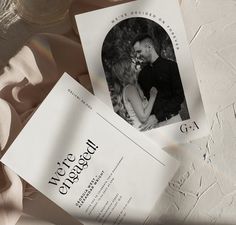 an image of a couple on their wedding day with the save the date card in front