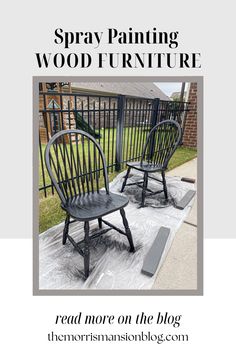 two wooden chairs sitting on top of a rug next to a black iron fence with the words spray painting wood furniture read more on the blog