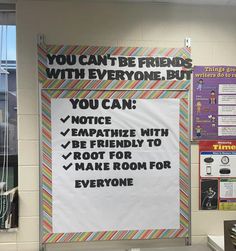 a bulletin board that has been placed on the wall in front of a classroom desk