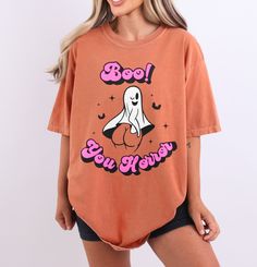 Boo You Horror Ghost shirt. Funny Halloween shirt perfect for the holiday! 100% USA cotton Pre-shrunk so no need to worry about shrinkage Comfort Colors Brand Heavyweight material for a more comfortable fit Relaxed fit. Order a size up for a more baggy feel. Halloween Cotton Tops With Text Print, Halloween Cotton Top With Text Print, Spooky Orange Crew Neck Top, Trendy Cotton Halloween Tops, Spooky Orange Tops With Funny Print, Halloween Trendy Crew Neck Top, Trendy Halloween Crew Neck Top, Halloween Text Print Relaxed Fit Top, Trendy Cotton Tops For Halloween