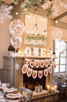 a fireplace with balloons and decorations on it