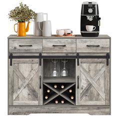 a wooden cabinet with two wine glasses on it and a coffee maker in the background