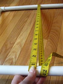 someone is measuring the length of a piece of wood