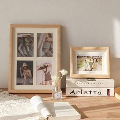 a table with books, flowers and pictures on it