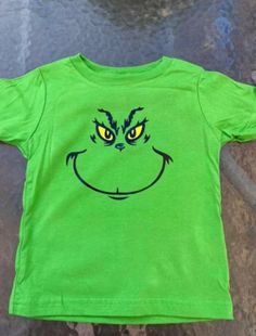 This fun tee is perfect for getting into the holiday spirit weather it be for fun or for dress up! Let us help you make adorable clothes for your kiddos! Diy Grinch Shirts For Kids, Diy Grinch Shirt, Star Wars Baby Clothes, Grinch Costumes, Grinch T Shirt, Grinch Shirt, Baby Onsie, Grinch Shirts, Holiday Kids