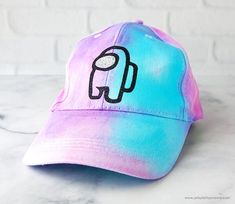 a tie dye baseball cap with an elephant on it