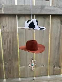 ⚡️🌵Super cute car charm includes 1 cow print hat, 1 burnt sienna hat, and 1 cactus charm.🌵⚡️ ⚡️Hat size: 3in  ⚡️Comes ready to hang Cowboy Hat Car Charm, Cow Print Hat, Mini Cowboy Hat, Mini Cowboy, Market Day Ideas, Cactus Keychain, Burnt Sienna, Hat Ideas, Cute Keychain