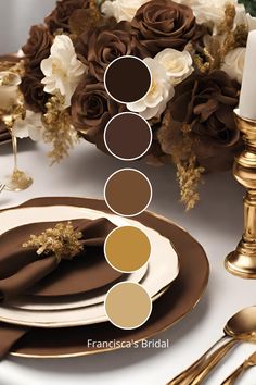 the table is set with gold, brown and white place settings for two people to sit at