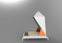 a white bed with an orange triangle on it's headboard and foot board