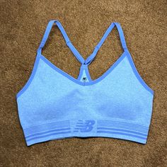 Nwot. Woman’s New Balance Sports Bra. In Blue, Size L. New Balance Sporty Activewear For Sports, Sporty New Balance Activewear For Sports, New Balance Athleisure Activewear For Workout, Sporty Light Blue Seamless Activewear, New Balance Moisture-wicking Activewear, New Balance Moisture-wicking Sportswear, New Balance Moisture-wicking Athleisure Activewear, New Balance Athleisure Moisture-wicking Activewear, Seamless Blue Sports Bra