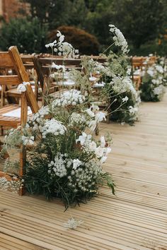 an instagram photo with white flowers and wooden chairs