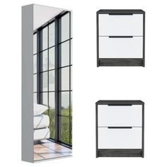 three white drawers sitting next to each other on top of a floor near a window