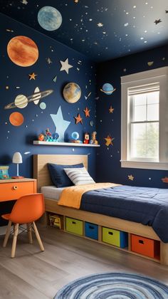 a child's bedroom decorated in blue and orange with planets on the wall, desk and bed