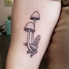 a small mushroom tattoo on the right thigh