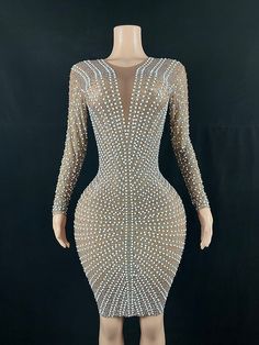 Tiwa beaded handmade long sleeve dress features a round neck and unique detailing style. Style is a bodycon dress with a hidden zipper Perfect outfit for all occasions for you to stand out. White Embellished Long Dresses, Long Sleeve Beaded Evening Dress, White Long Sleeve Dress With Pearl Embroidery, White Embellished Long Sleeve Dress, Fitted Long Sleeve Beaded Dress, White Long Sleeve Glamorous Dress, Glamorous White Long Sleeve Dress, White Long Sleeve Dress For Night Out, Long Sleeve Beaded Dress For Night Out