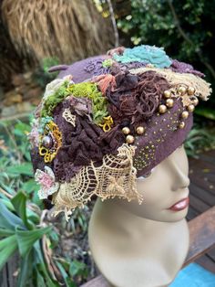 A one of a kind, romantic & elegant bohemian wool blend beret hat in woodland brown green and cream tones. This hat is embellished with a variety of vintage textiles, silks, old lace, vintage beads and hand sculpted flowers. Silk flowers with scattered beading, various sized bauble beads, seed beading and hand dyed vintage crochet. Vintage crochet elements, beads and scattered treasures depicting a garden of flowers in shades of browns, creams, gold and green. It is a unique one of a kind handma Embellished Beret, Crochet Elements, Sculpted Flowers, Garden Of Flowers, Elegant Bohemian, Seed Beading, Crochet Vintage, Cream Tones, Lace Vintage