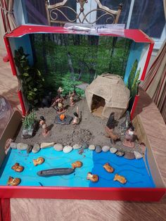 an open box filled with toys on top of a table